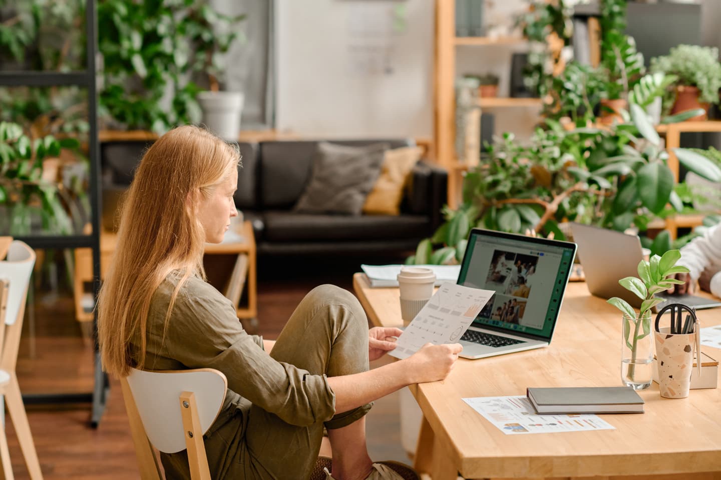 Woman sitting on a computer at an office