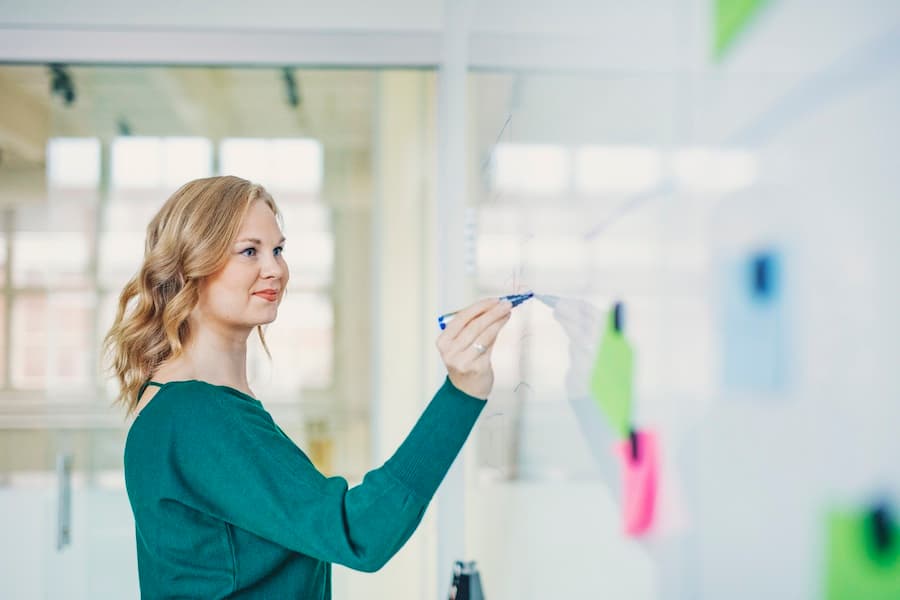 Woman drawing on a whiteboard